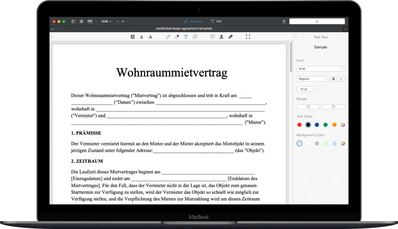 Ein Wohnraummietvertrag wird auf einem MacBook angezeigt. Eine kostenlose mietvertrag vorlage ist sichtbar.