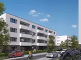 Moderne Wohnanlage im Kronprinzenviertel Dortmund mit Balkonen, Autos und grünen Bäumen.