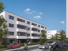 Moderne Wohnanlage im Kronprinzenviertel Dortmund mit Balkonen, Autos und grünen Bäumen.
