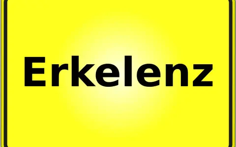 Gelbes Ortsschild mit schwarzer Schrift "Erkelenz". Hier finden Sie Informationen zum Mietspiegel Erkelenz.