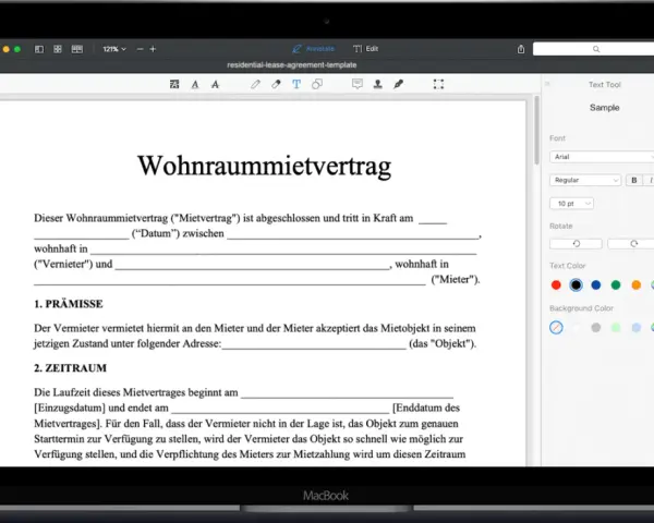 Ein Wohnraummietvertrag wird auf einem MacBook angezeigt. Eine kostenlose mietvertrag vorlage ist sichtbar.