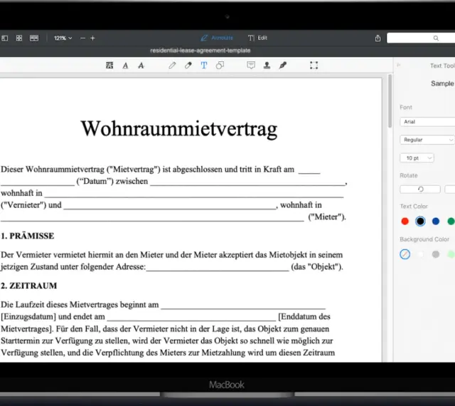 Ein Wohnraummietvertrag wird auf einem MacBook angezeigt. Eine kostenlose mietvertrag vorlage ist sichtbar.