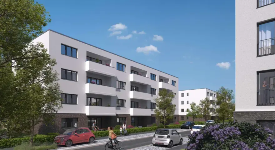 Moderne Wohnanlage im Kronprinzenviertel Dortmund mit Balkonen, Autos und grünen Bäumen.