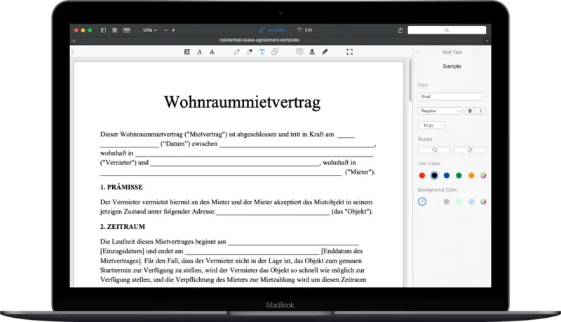 Ein Wohnraummietvertrag wird auf einem MacBook angezeigt. Eine kostenlose mietvertrag vorlage ist sichtbar.